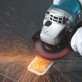 Makita 9558HNR leņķa slīpmašīna + metāla korpuss